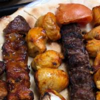 Grill For 1 · Grilled beef, kefta and chicken kabab. Served with hummus, salad and rice. (Includes pita br...