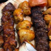 The Special Grill For 4 · A combination of grilled beef, kofta and chicken kababs. Served with salad and rice. (Includ...