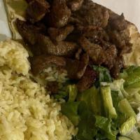 Beef Shawarma Plate · Filet mignon chopped and seasoned. Served with hummus, salad and rice. (Includes pita bread)