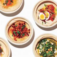 Vegetarian Plate · Hummus, tabbouleh, grape leaves, falafel and mutabal. (Includes pita bread)