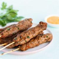 2 Skewer Kefta Kabab Plate · Home grounded top sirloin, parsley, onions and spices. Served with hummus, salad and rice. (...