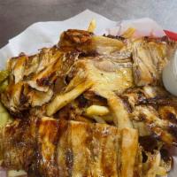 Chicken Shawarma Fries · Bed of fries topped with chicken, garlic sauce, diced pickles