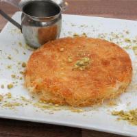Cheese Knefe · Sweet white cheese, kataif, and pistachios on top with orange blossom syrup.