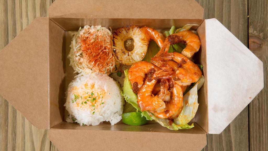 Shrimp Combo · 8 pieces of headless shrimp, choice of sauce with steamed rice and choice of side.