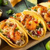 Hard Shell Shrimp Taco · Fresh fried seasoned shrimp in a hard taco shell topped with fresh shredded cheese, cabbage,...