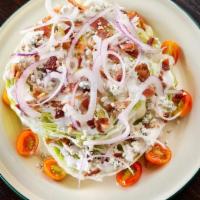 Wagon Wheel Wedge · Two large wheels of iceberg, red onion, bacon, blue cheese crumbles.  Add brisket for an ama...