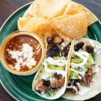Taco Plate · Taco Plate - Two flour tortillas stuffed with smoked pork or chicken, onion cilantro, jack c...