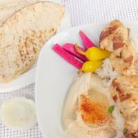 Chicken Kabob Plate · Marinated boneless and skinless chicken. Served with hummus, salad, rice, garlic, grilled to...