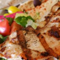 Chicken Breast Plate · Marinated boneless and skinless chicken breast. Served with hummus, salad, rice, garlic, gri...