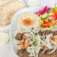Combo Kabob Plate · Skewer of beef kabob, chicken kabob, and kafta kabob. Served with hummus, salad, rice, parsl...