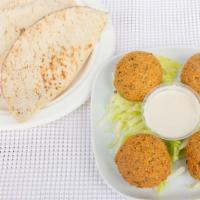 Falafel Plate · A golden fried mixture of garbanzo beans, parsley, and spices. Served with hummus, salad, ta...