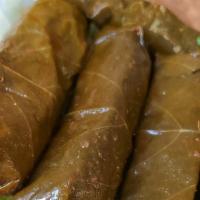 Grape Leaves (5 Pieces) · Grape leaves filled with rice, finely diced tomatoes, parsley, and lemon juice.