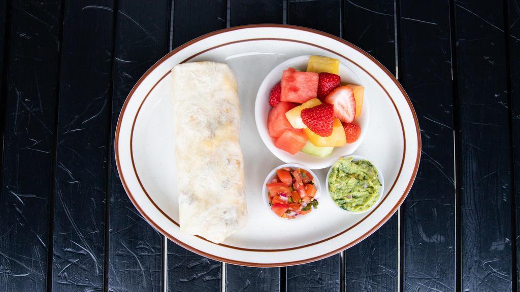 Breakfast Burrito · Three eggs scrambled with black beans, guacamole, cheese & your choice of Mexican chorizo sausage, bacon, or turkey bacon in a flour tortilla. Served with fruits or roasted potatoes.