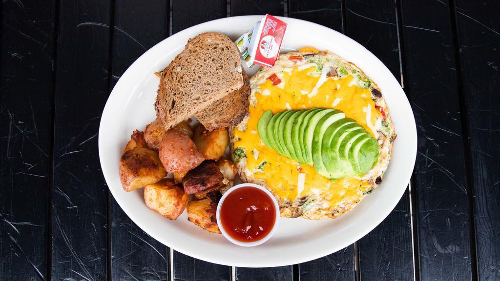 Mustard Seed Omelet · Served with egg whites ONLY, tomato, avocado, mushrooms, broccoli, and basil with jack cheddar cheese. Served with roasted potatoes or fresh fruit, and a choice of rosemary, multi-grain, olive, marble rye, or sourdough toast. Add egg whites for additional cost.