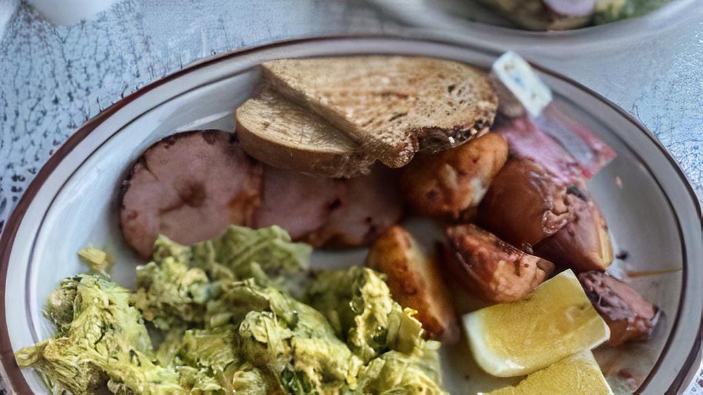 Green Eggs & Ham · Thick sliced Canadian bacon accompanied by farm fresh eggs, scrambled with a garlic basil pesto. Served with fruits or roasted potatoes.