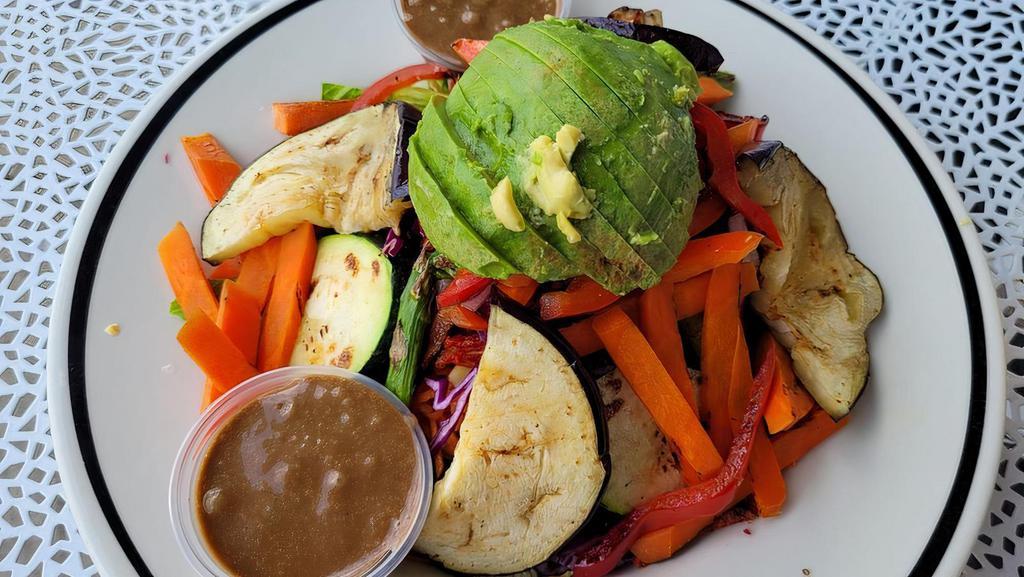 Grilled Vegetable Salad · Grilled asparagus, eggplant, zucchini, roasted bell peppers, carrots, green onions, corn, romaine lettuce, avocado, and sun dried tomatoes. Served with Dijon vinaigrette or balsamic vinaigrette dressing. Add an extra chicken breast , crispy tofu or salmon for additional cost.
