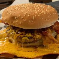 Hawaiian Bacon Squeeze Burger · Grilled 1/3 lb. patty topped with melted cheddar cheese, bacon, teriyaki sauce, pineapple, m...