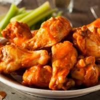 Traditional Buffalo Wings · Delicious traditional crispy wings tossed in buffalo sauce with carrots and celery.