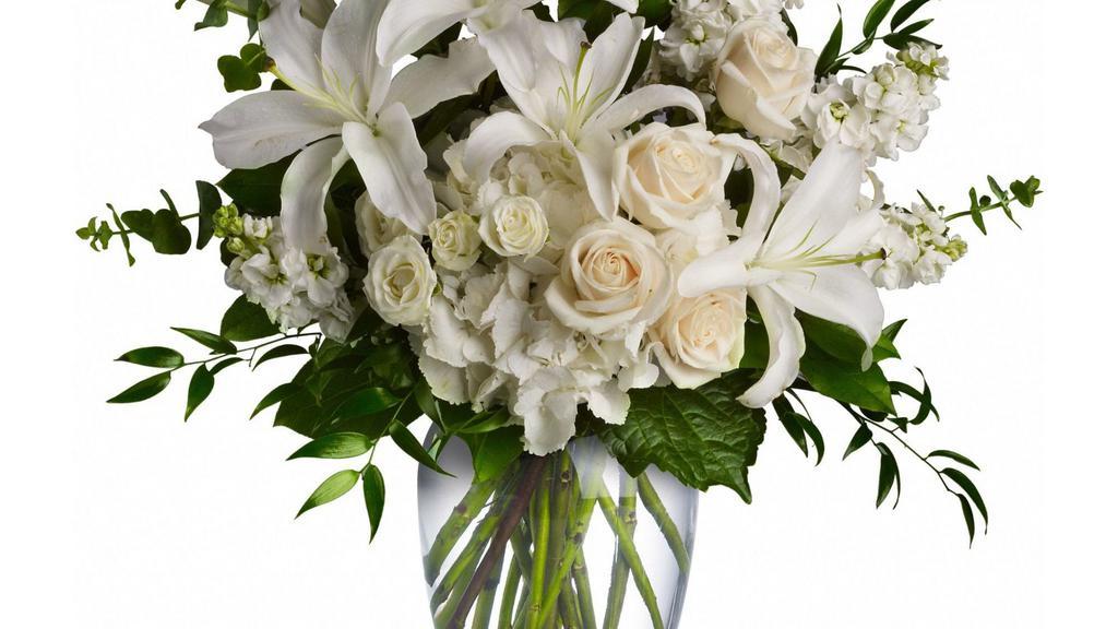 Dreams From The Heart Bouquet By Teleflora · A lovely bouquet to soothe and comfort, a variety of white and peach blossoms sends your hope and strength. Beautifully. Beautiful flowers such as white hydrangea, spray roses and stock, peach roses, eucalyptus and more fill a tall glass vase. Approximately 24