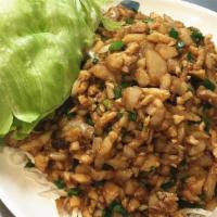 Chicken Lettuce Wraps · Minced chicken with mushrooms, water chestnuts and green onions wok stir fried in a house sa...