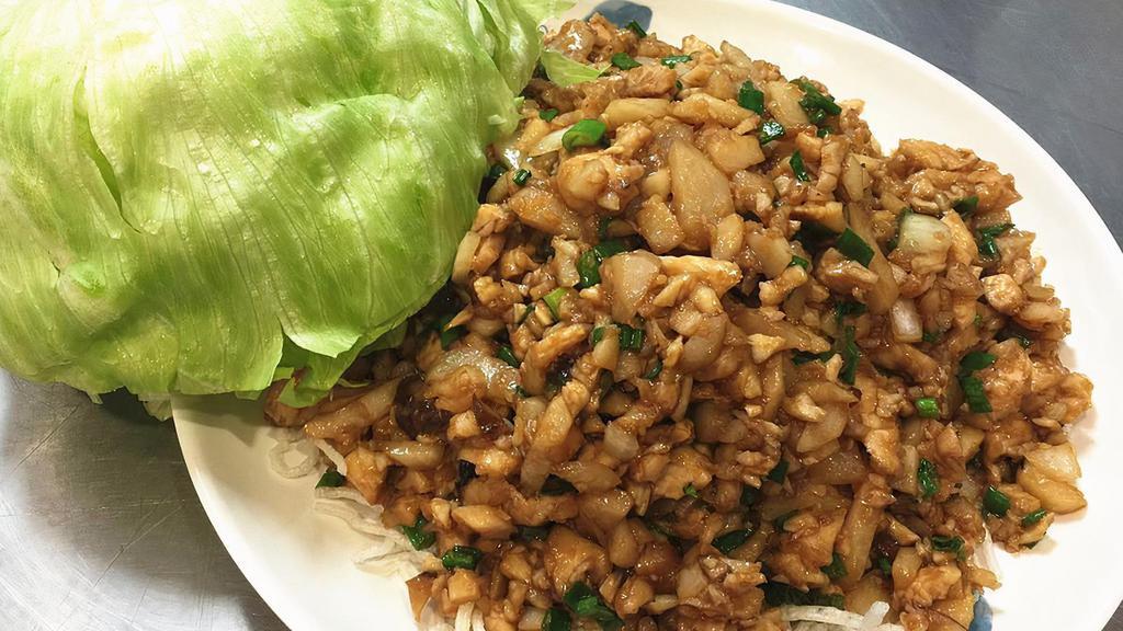 Chicken Lettuce Wraps · Minced chicken with mushrooms, water chestnuts and green onions wok stir fried in a house sauce served with lettuce wraps.