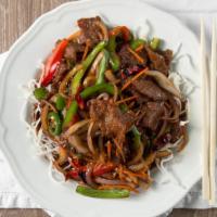 Mongolian Beef · Tender sliced beef with bell pepper, onion, and carrots stir fried in a spicy Mongolian sauce.