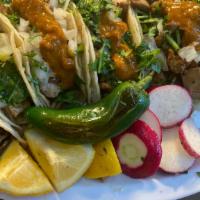 Carnitas Tacos · Carnitas tacos with optional cilantro, onion, and green or red salsa/ tacos con opcion de  c...
