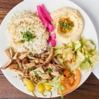 Chicken Shawerma Plate · Rice, Hummus, Carrots, Pita bread, and Pickled Turnips.