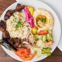 Beef Kebab Plate · Rice, Hummus, Carrots, Pita bread, and Pickled Turnips.