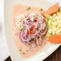 Ceviche Mixto · fresh fish, calamari, shrimp marinated in lime juice spicy sauce   served with lettuce, yams...