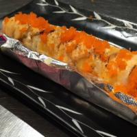 Sake Punch Roll · Salmon, shrimp tempura, spicy tuna, torched with spicy creme, garlic creme, and bonito flakes.