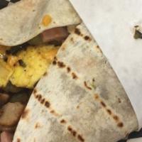 Hobo Breakfast Burrito · Loaded with ham, bacon, sausage, egg, cheddar cheese, onions, paprika, potatoes, and bell pe...