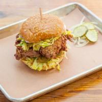 Fried Chicken Sandwich · Brioche bun, honey mustard slaw, classic mayo and pickled jalapenos. Comes with two sides.