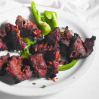 Bihari Kebab · Tender boneless pieces of beef marinated in exotic house spices.