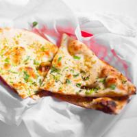 Garlic Naan · White leavened bread stuffed with fresh garlic and baked in tandoor.
