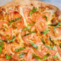 Margherita Pizza · Vegan and gluten free options available. Fresh basil, tomatoes, garlic, and Mozzarella cheese.