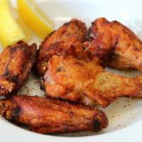 Lemon Pepper Wings · Chicken wings on the bone, tossed in a traditional flavorful lemon pepper sauce, and served ...