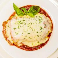 Meat Lasagna · Fresh homemade lasagna served with marinara sauce and Mozzarella cheese.