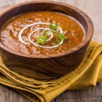 Daal Makhani · A classic daal made of simmered yellow lentils in tomato, butter and spices. Goes excellent ...