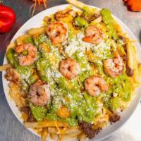 Surf And Turf Monster Fries · Steak, shrimp, beans, rice, chipotle sauce, and cheese.