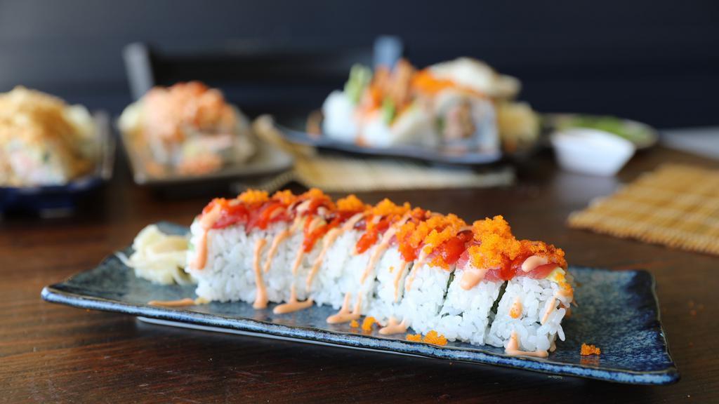 Fire Dragon Roll · Hot and spicy. In: shrimp tempura, snow crab, cucumber. Out: avocado, tuna with special spicy sauce, masago.
