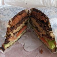 The Grand Puba Sandwich · Corned beef, turkey, steak, grilled bacon, swiss, lettuce, tomato, red onion, mayo and deli ...