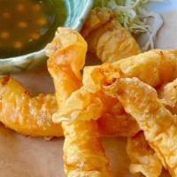 Royal Shrimp · Delicious jumbo shrimp wrapped in crisp wontons served with house-made sweet and sour sauce