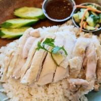 Kao Man Kai · Streamed dark meat chicken on the bed of ginger rice, served with our house special soy ging...