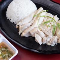 Hainan Poached Chicken Rice · Poached jidori chicken (free range chicken)  over rice, served w/ ginger scallion paste & sw...