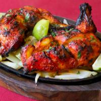 Chicken Tandoori · 1/2 Chicken marinated with yogurt and spices then roasted in clay oven