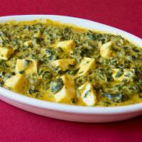 Sagh Paneer · Spinach cooked with home made cheese in delicious creamy sauce