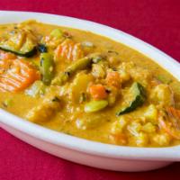 Vegetable Korma · Creamy vegetable curry with garlic, ginger, coconut, and mild spices