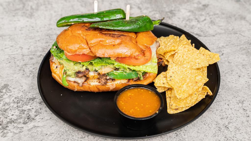 Torta Alambre · Toppings: Carne Asada cheese, onions, bell peppers, bacon, chipotle mayonnaise, lettuce, guacamole, tomato, jalapeno, chips and salsa.