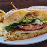 Calamari Steak Sandwich Lunch · Panko crust, lettuce, onions, tomato, tarter sauce and toasted ciabatta.